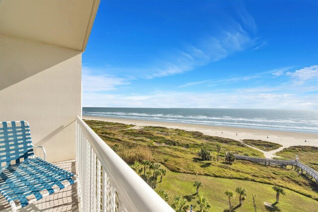 balcony with a beach view and a water view