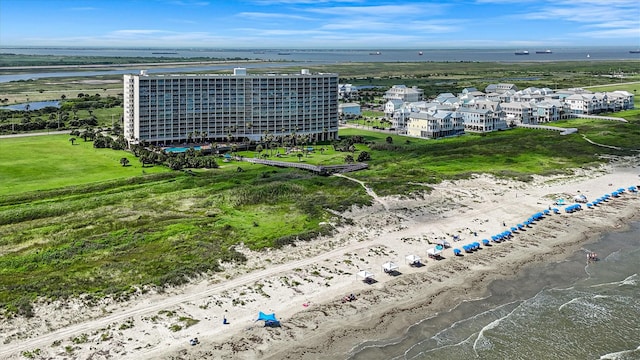 drone / aerial view with a water view and a view of the beach