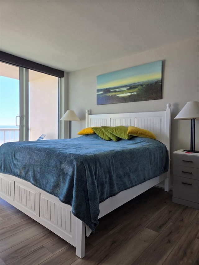 bedroom with dark wood-type flooring