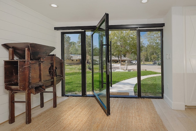 entryway with light hardwood / wood-style floors