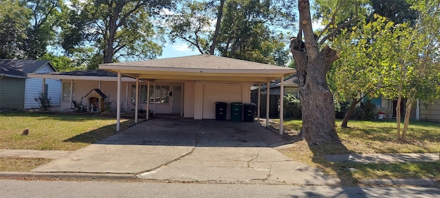 view of front facade with a front yard and a carport