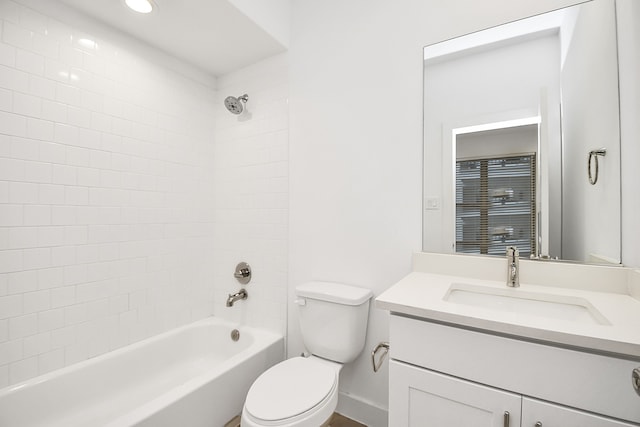 full bathroom featuring vanity, toilet, and tiled shower / bath