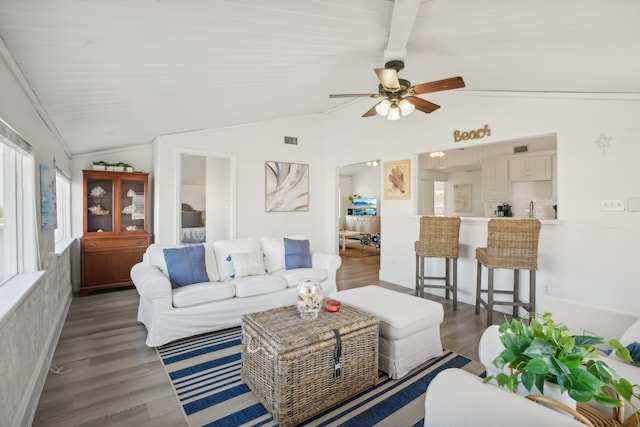 living room with ceiling fan, lofted ceiling with beams, and dark hardwood / wood-style floors