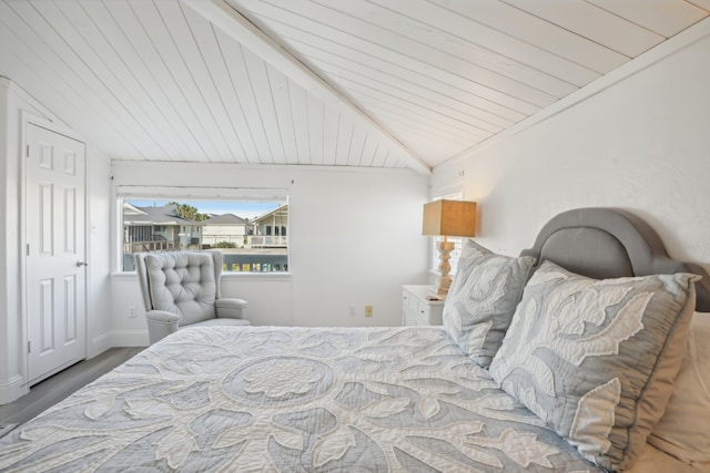 bedroom with hardwood / wood-style floors, lofted ceiling, and wood ceiling