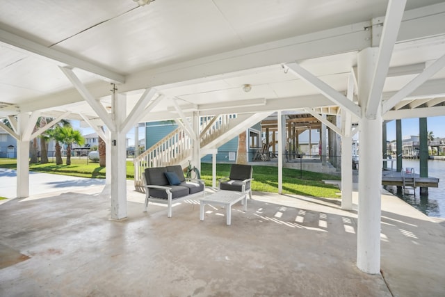 view of patio / terrace with an outdoor living space and a water view