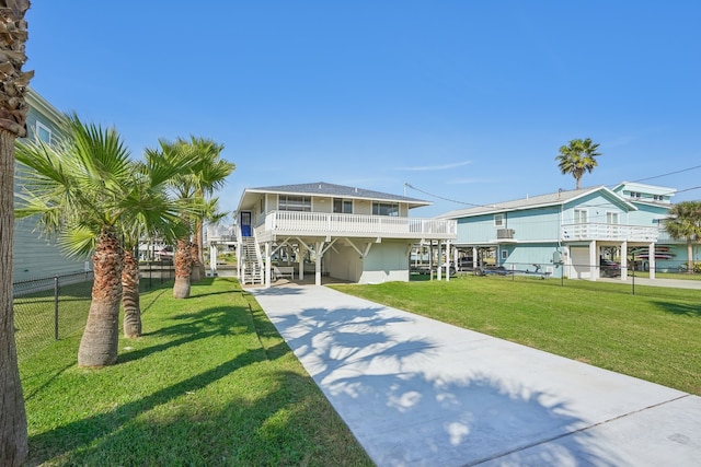 view of front of house featuring a front yard and a carport