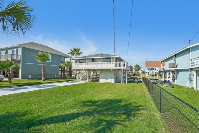 rear view of property with a yard