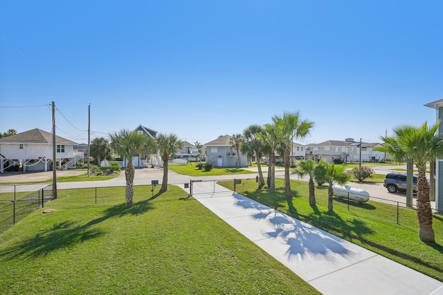 view of home's community with a lawn