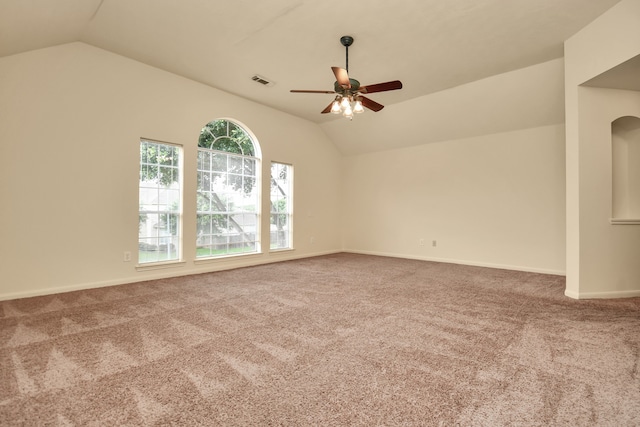 carpeted empty room with ceiling fan and lofted ceiling