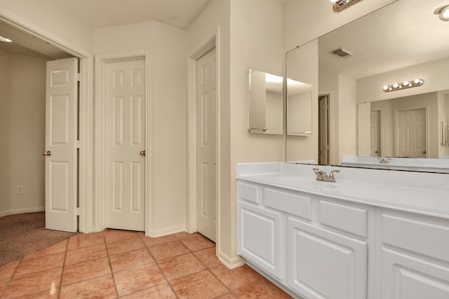 bathroom with tile patterned flooring and vanity