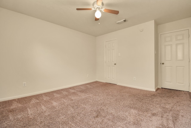 empty room featuring carpet flooring and ceiling fan