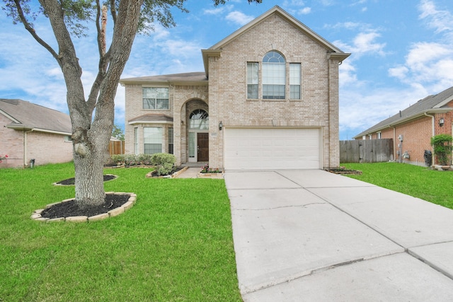 view of front of property with a garage and a front lawn