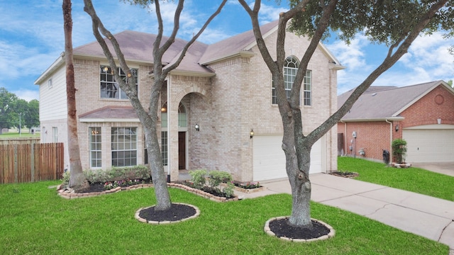 view of front of home with a garage and a front lawn