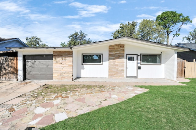 garage featuring a lawn