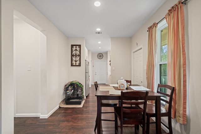 5907 Wedgefield St, Houston, TX 77028 - dining room featuring dark wood finished floors, baseboards, and recessed lighting