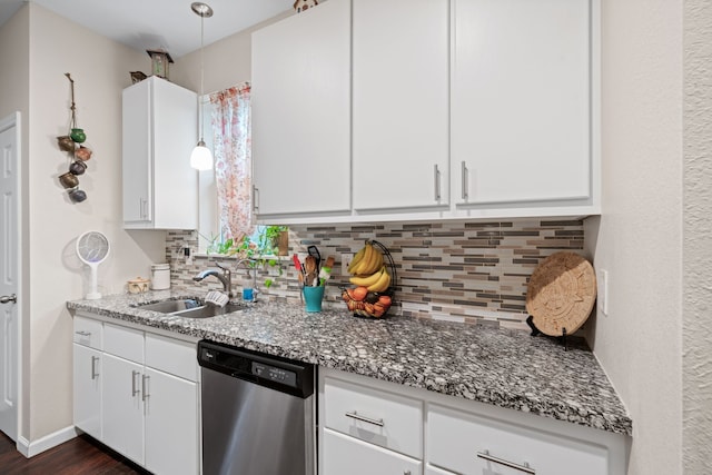 5907 Wedgefield St, Houston, TX 77028 - kitchen featuring dishwasher, a sink, decorative backsplash, and white cabinetry