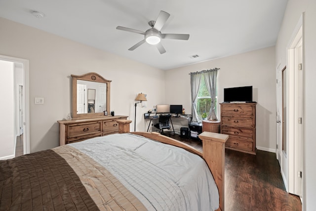 5907 Wedgefield St, Houston, TX 77028 - bedroom featuring dark wood-style floors, baseboards, an office area, and ceiling fan