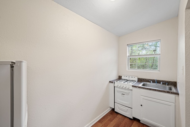 5907 Wedgefield St, Houston, TX 77028 - washroom with a sink and dark wood-style floors