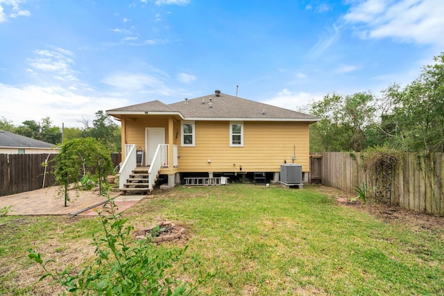 5907 Wedgefield St, Houston, TX 77028 - back of property with a patio, central AC, and roof with shingles