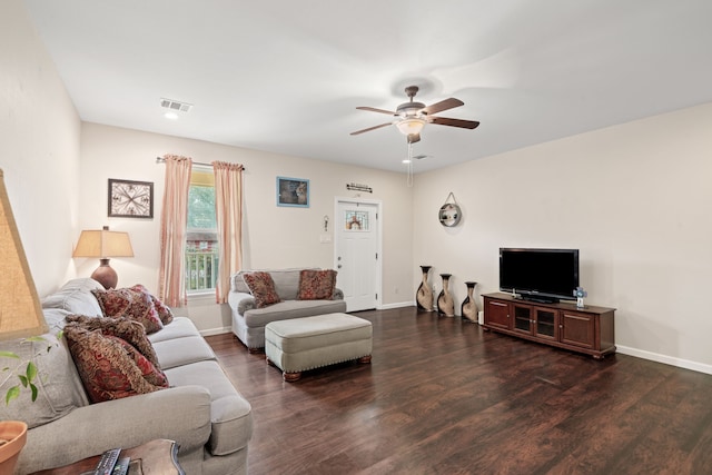 5907 Wedgefield St, Houston, TX 77028 - living area featuring wood finished floors, a ceiling fan, and baseboards