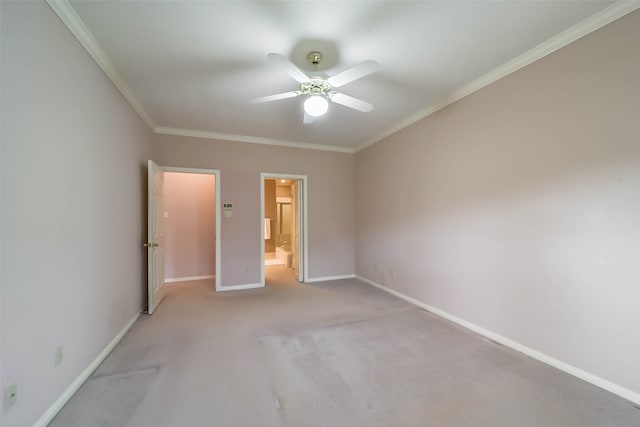 unfurnished bedroom featuring ceiling fan, ornamental molding, light carpet, and ensuite bath