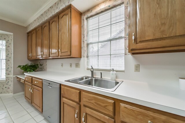 kitchen featuring dishwasher, ornamental molding, sink, and light tile patterned floors