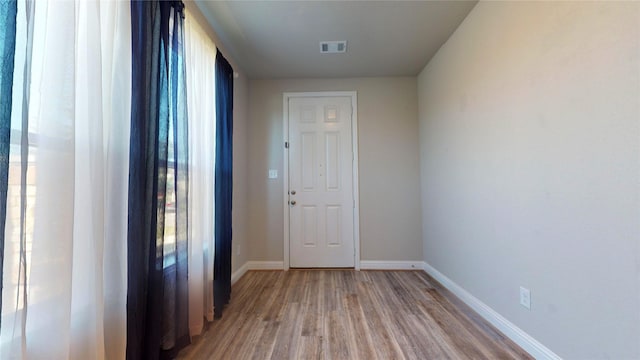 interior space featuring hardwood / wood-style floors and a wealth of natural light