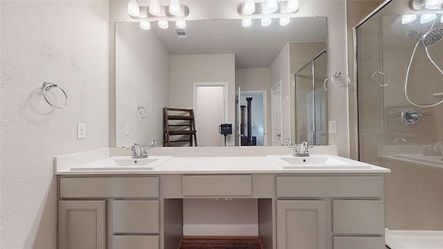 bathroom with vanity and an enclosed shower