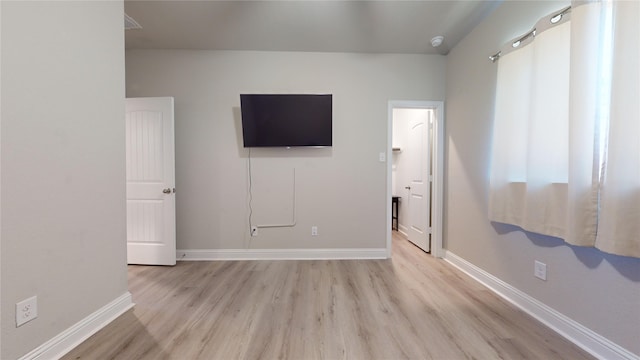 unfurnished bedroom featuring light wood-type flooring