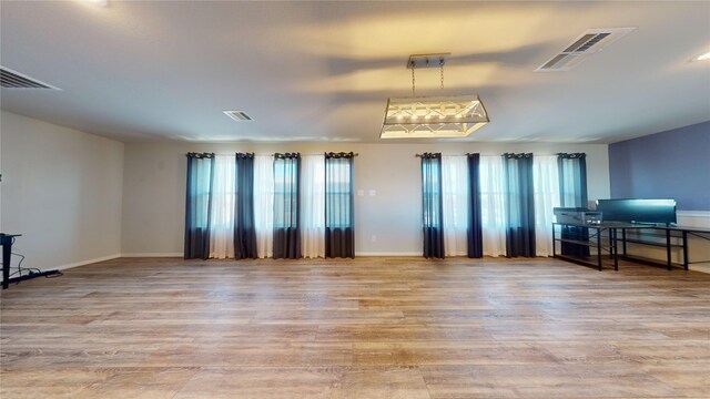 unfurnished living room with light hardwood / wood-style floors