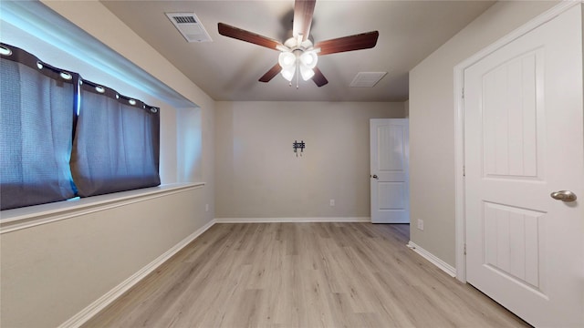 unfurnished room with light hardwood / wood-style floors and ceiling fan