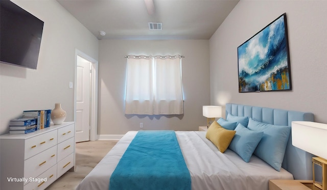 bedroom featuring light wood-type flooring