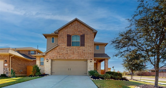 view of front property featuring a garage and a front yard