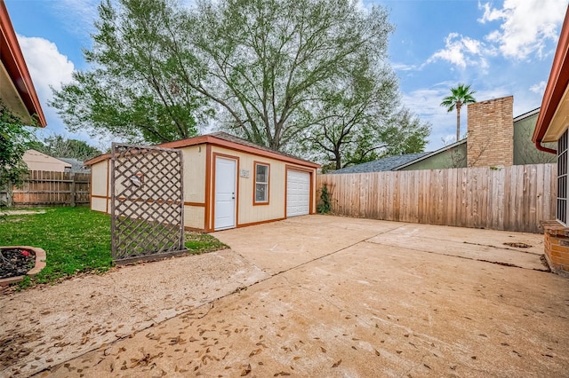 view of patio / terrace featuring an outbuilding