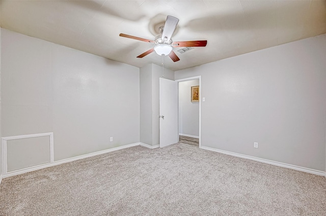 unfurnished room featuring ceiling fan and carpet floors