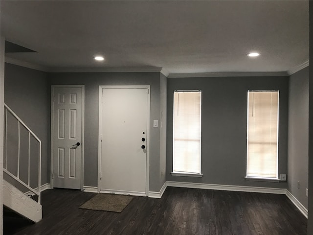 entryway featuring plenty of natural light, dark hardwood / wood-style flooring, and ornamental molding