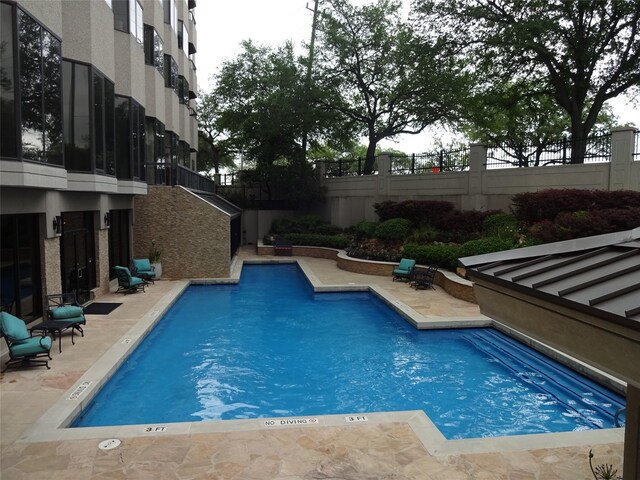 view of pool featuring a patio area