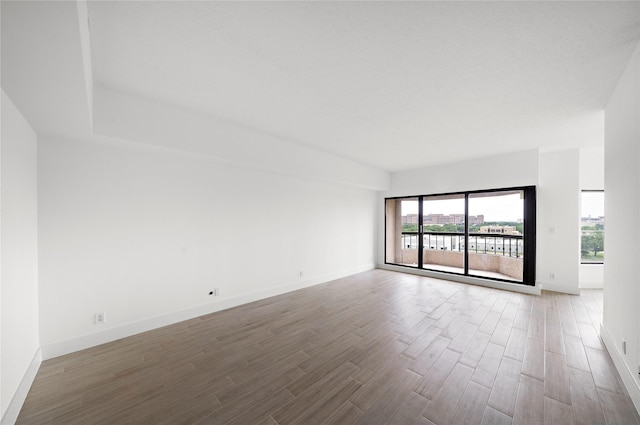 2001 Holcombe Blvd Unit 705, Houston, TX 77030 - empty room with wood finished floors and baseboards