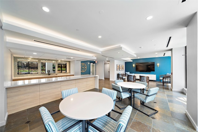2001 Holcombe Blvd Unit 705, Houston, TX 77030 - dining space featuring baseboards, stone tile floors, and recessed lighting