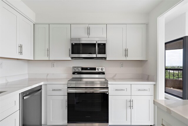 2001 Holcombe Blvd Unit 705, Houston, TX 77030 - kitchen featuring stainless steel appliances and white cabinetry