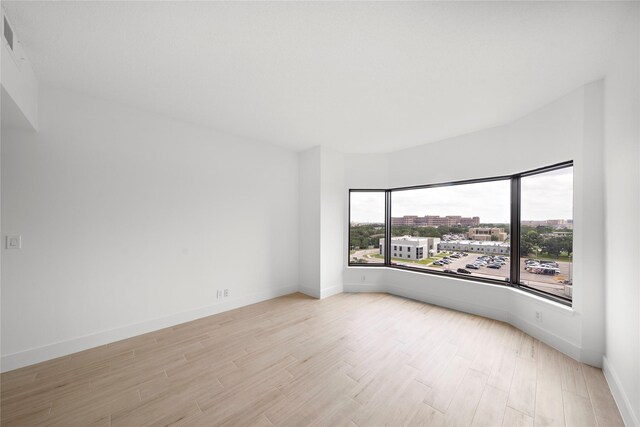 2001 Holcombe Blvd Unit 705, Houston, TX 77030 - spare room with light wood-style floors and baseboards