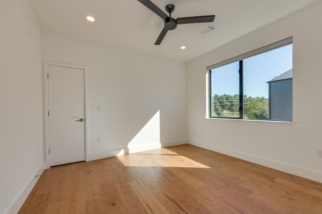 unfurnished room featuring ceiling fan and light wood-type flooring