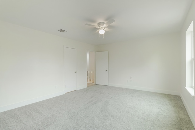 carpeted empty room with ceiling fan