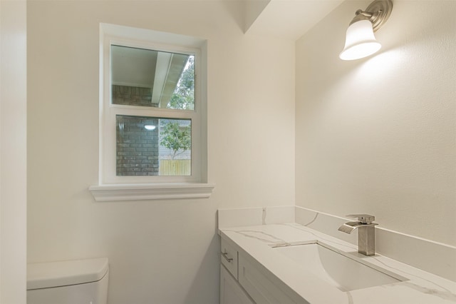 bathroom with vanity and toilet