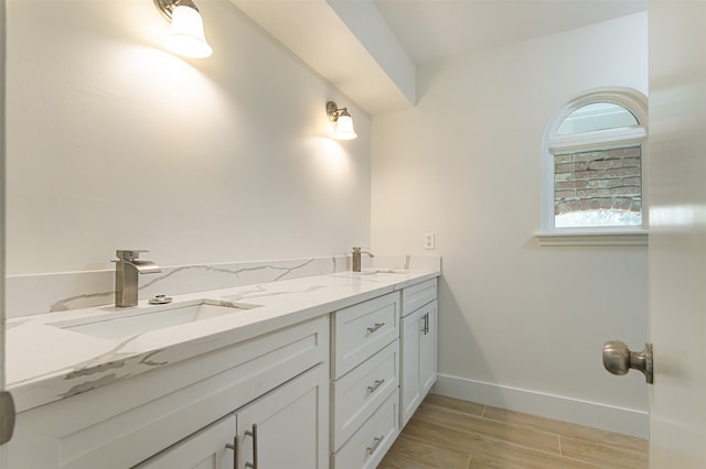 bathroom featuring vanity and wood-type flooring