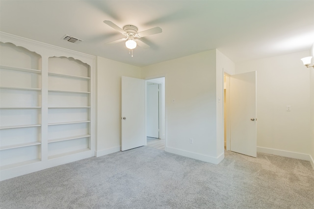 unfurnished bedroom featuring light colored carpet and ceiling fan