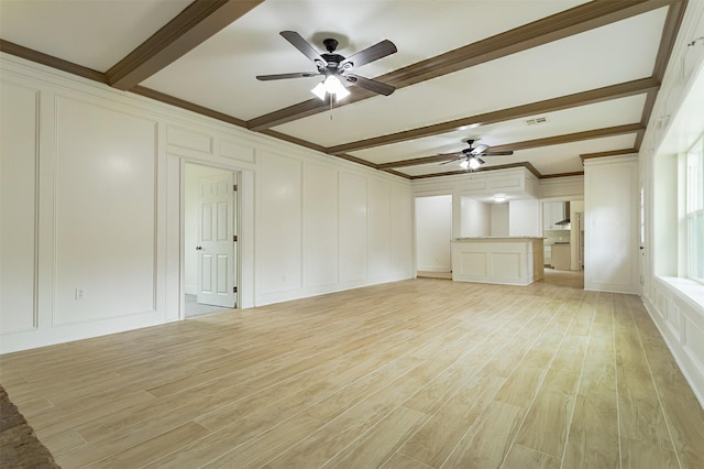 unfurnished living room with beamed ceiling, ceiling fan, and light hardwood / wood-style flooring