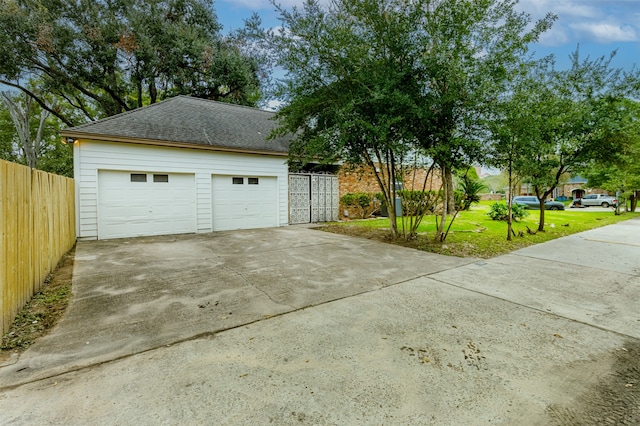 garage with a yard