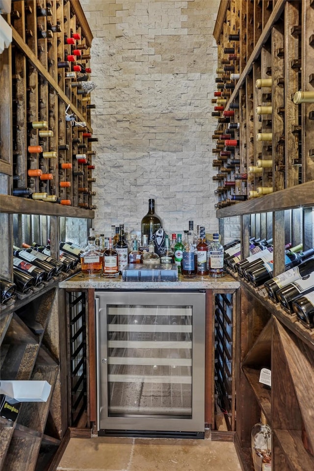 729 Pegasus Ln, League City, TX 77573 - wine cellar featuring a dry bar, beverage cooler, and concrete floors
