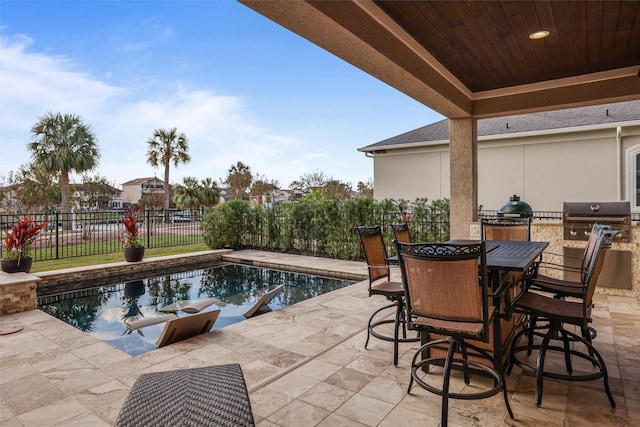 729 Pegasus Ln, League City, TX 77573 - view of swimming pool featuring grilling area, fence, a patio, exterior kitchen, and a fenced in pool